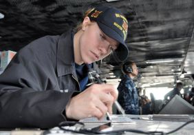 Jaime Plym - navigator plotting course for USS R Reagan